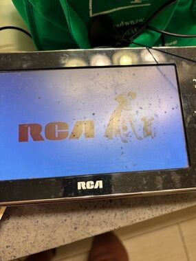 RCA Portable television packaged in a black carrying case.